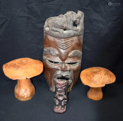 A large carved hardwood African mask, together with two