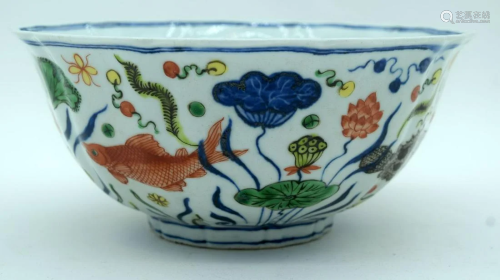 A Chinese porcelain scalloped bowl decorated with fish