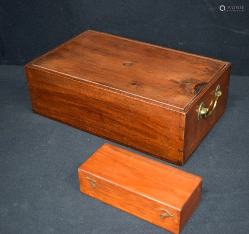 An antique wooden brass handled lidded box together
