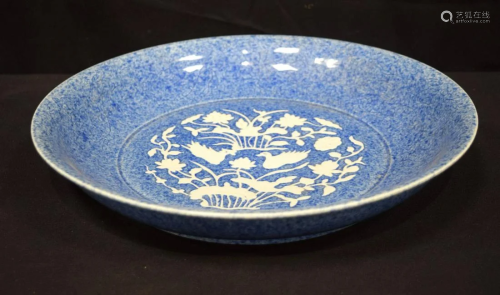 A large Chinese porcelain blue glazed dish decorated