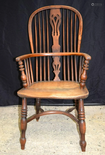 A 19th century wooden Windsor chair. 106 x 52cm