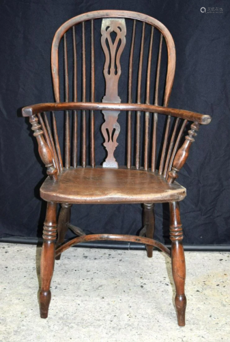 A 19th century wooden Windsor chair. 101 x 60cm