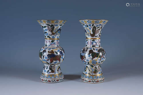 A Pair Of Closionne Vases