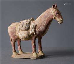 A CHINESE PAINTED POTTERY FIGURE OF A MULE  NORTHERN QI DYNA...