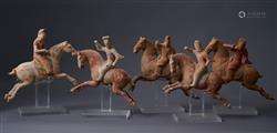 A GROUP OF CHINESE POTTERY TOMB FIGURES OF POLO PLAYERS  TAN...