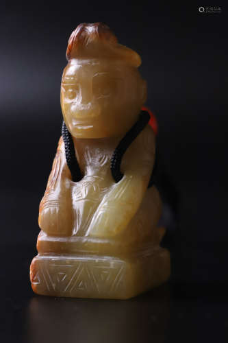 A Carved Kneeling Man Figure Statue