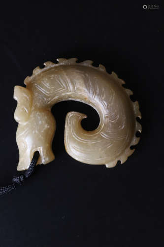 A Carved Jade Dragon Ring Pendant