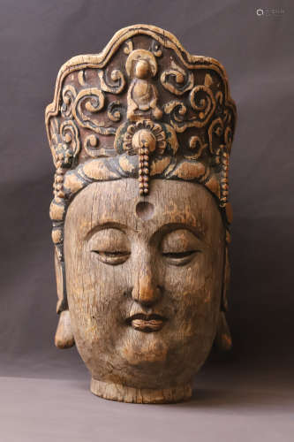 A Carved Wood Buddha Head Figure Statue
