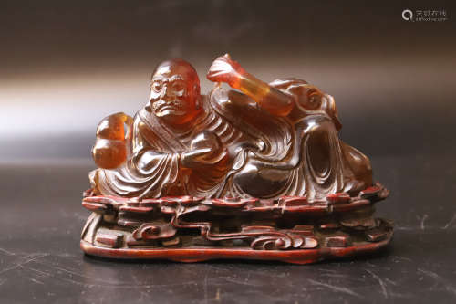 A Carved Arhat Amber Figure Statue