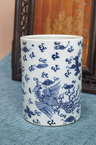 A BLUE AND WHITE DRAGON AND PHOENIX BRUSH POT