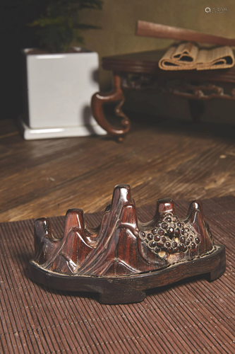 A CARVED SANDALWOOD BRUSH RACK