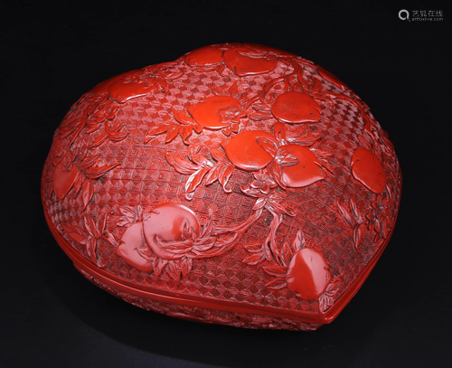 A CARVED CINNABAR LACQUER PEACH-FORM BOX & COVER