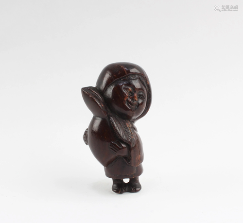 A Carved Wooden Figurine