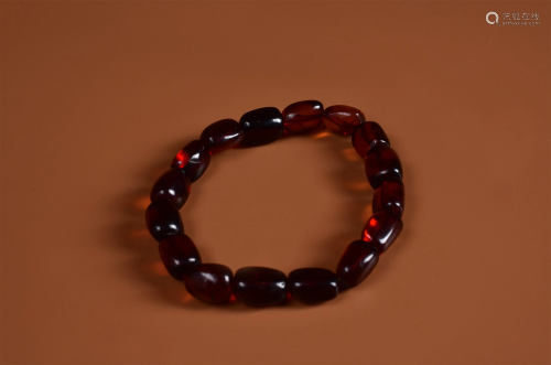 A PIECE OF AMBER BEADS HAND STRING