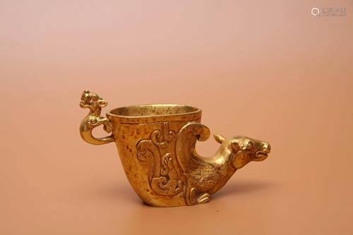 A GILDING BRONZE BEAST-HEAD CUP