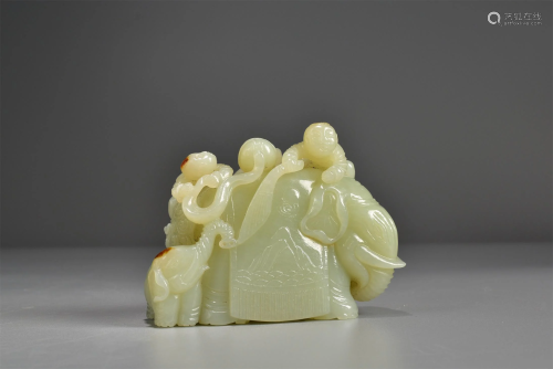 A CHINESE JADE FIGURE OF BOY AND ELEPHANT