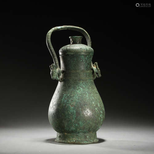 Ancient bronze loop-handled teapot