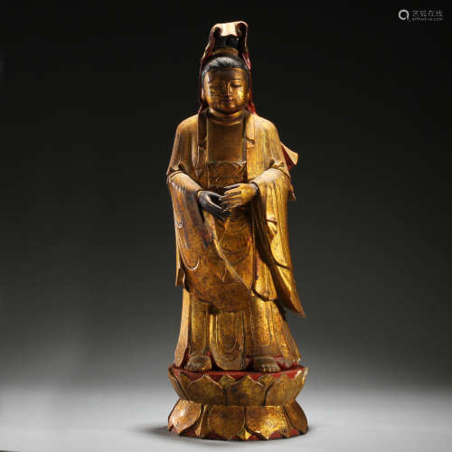 Ancient wooden painted golden Buddha