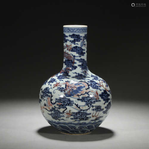 Blue and white enamel vase with red dragon pattern