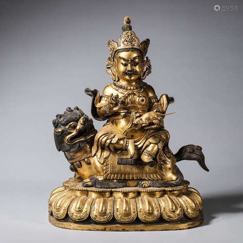 CHINESE GILT BRONZE FIGURE OF JAMBHALA