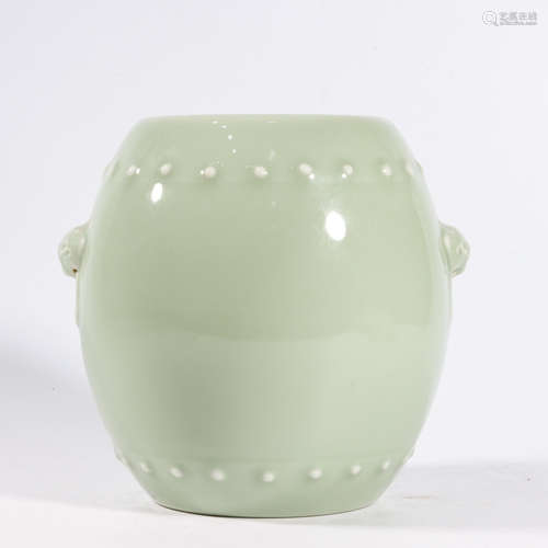 A CELADON GLAZE BARREL-FORM LION-EARED STOOL