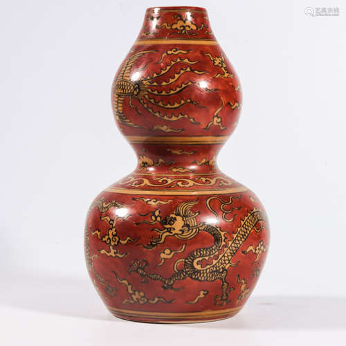 A RED GROUND YELLOW ENAMEL ‘DRAGON AND PHOENIX’ DO