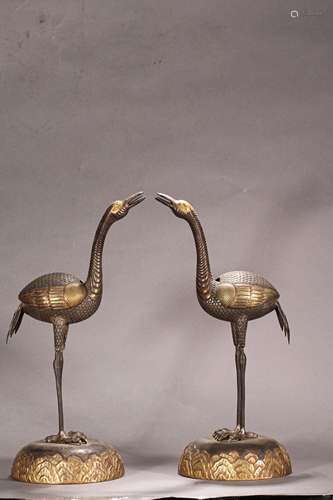 A PAIR OF MING DYNASTY SILVER GILDED CRANE INCENSE BURNERS