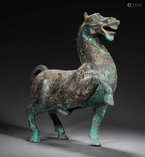 A HAN DYNASTY BRONZE HORSE