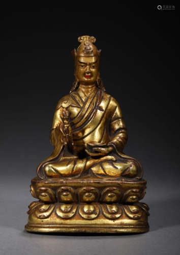 A GILDED BRONZE GURU BUDDHIST STATUE; MING DYN.,A GILDED BRO...