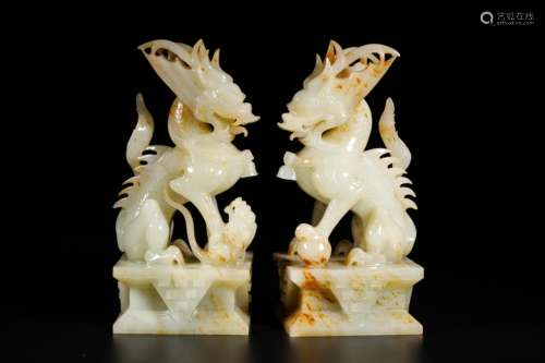 A PAIR OF LIAO DYNASTY HETIAN WHITE JADE BEAST ORNAMENTS,A P...