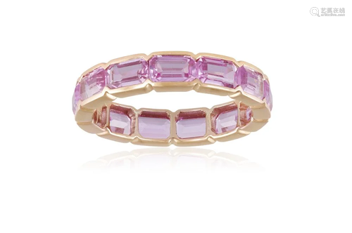 A COLOURED SAPPHIRE ETERNITY RING Composed of a