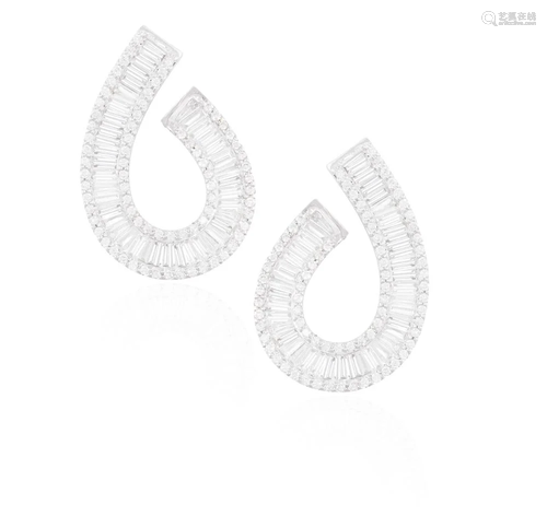 A PAIR OF DIAMOND EARRINGS Of swirl design, each