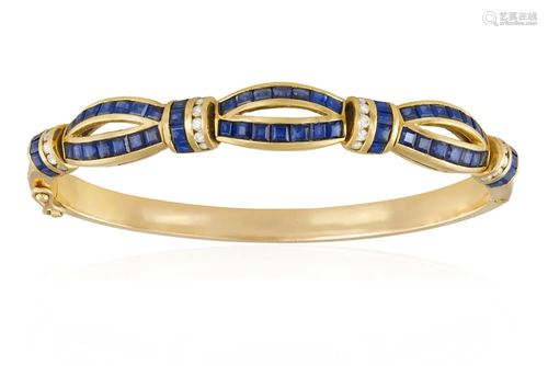 A SAPPHIRE AND DIAMOND BRACELET The hinged bangle with