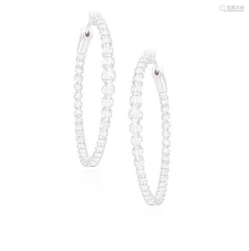 A PAIR OF DIAMOND HOOP EARRINGS Each hoop set with a