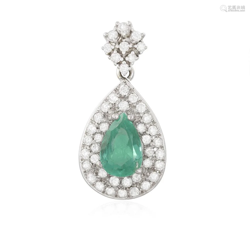 AN EMERALD AND DIAMOND PENDANT The central pear-shaped