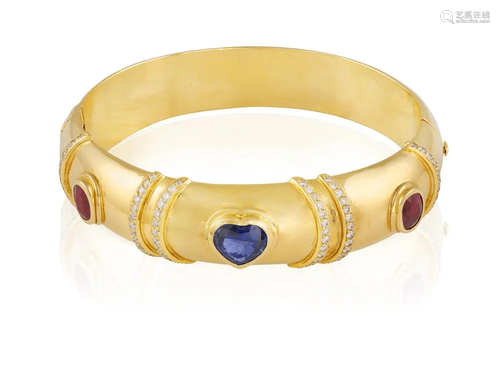 A SAPPHIRE, RUBY AND DIAMOND BANGLE The hinged bangle