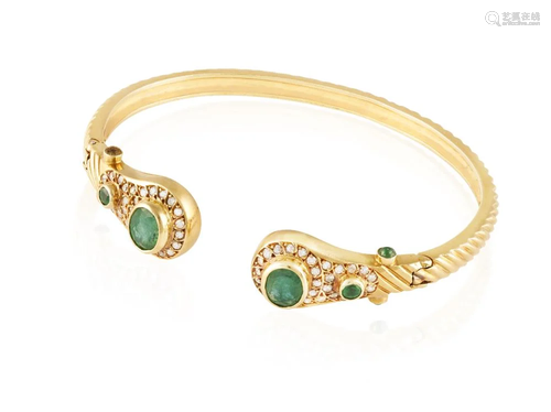 AN EMERALD AND DIAMOND BANGLE The reeded gold bangle