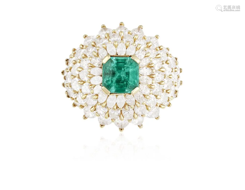 AN EMERALD AND DIAMOND COCKTAIL RING The central