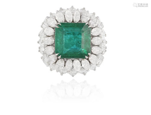 AN IMPORTANT EMERALD AND DIAMOND DRESS RING The central