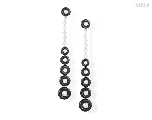 A PAIR OF DIAMOND PENDENT EARRINGS Each circular o…