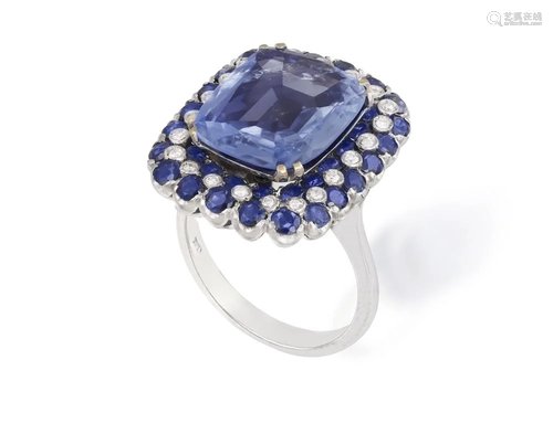 A SAPPHIRE AND DIAMOND DRESS RING The central