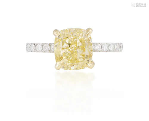 A FANCY-COLOURED DIAMOND AND DIAMOND RING The