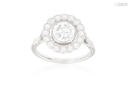 A SINGLE-STONE DIAMOND RING The central brilliant-cut