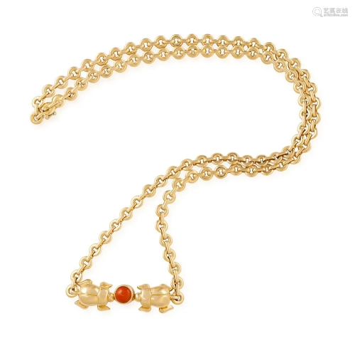 A CORAL AND GOLD NECKLACE, BY CARTIER The circular-…
