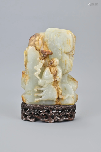 A Large Chinese Celadon Jade And Russet Carving Of A