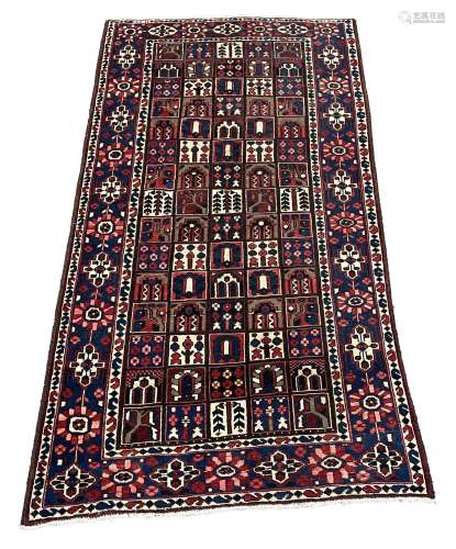 Persian red and blue ground rug