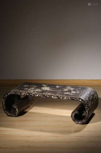 A MOTHER-OF-PEARL BLACK LACQUER SCROLL-FORM TABLE