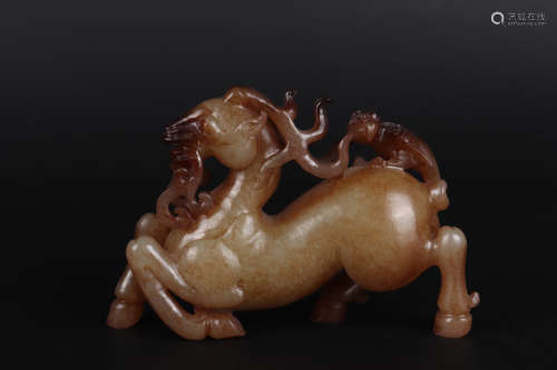 A BROWNISH FIGURE OF HORSE