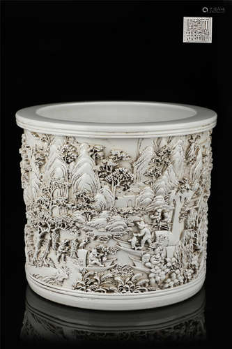 Large brush holder with carved landscape figures in white gl...