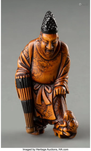 A Japanese Carved Wood Man Holding an Umbrella N